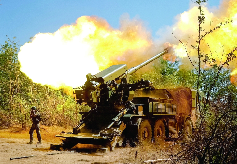 A service member of the Ukrainian Armed Forces fires towards Russian troops near a front line, in Zaporizhzhia region. — Reuters