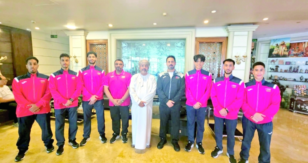 Picture of the players, the administrator and the head of the Oman Karate Committee.