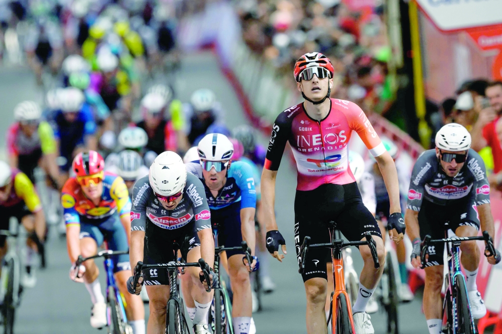Ineos Grenadiers British rider Ben Turner crosses the finish line in first place during the fourth stage of the Vuelta a Espana. — AFP