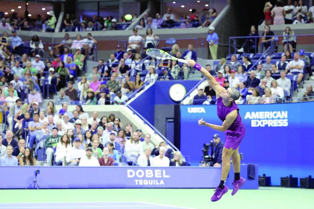 Spain's Carlos Alcaraz serves to Italy's Mattia Bellucci at the end of their men's singles second round tennis match on day four of the US Open tennis tournament. — AFP