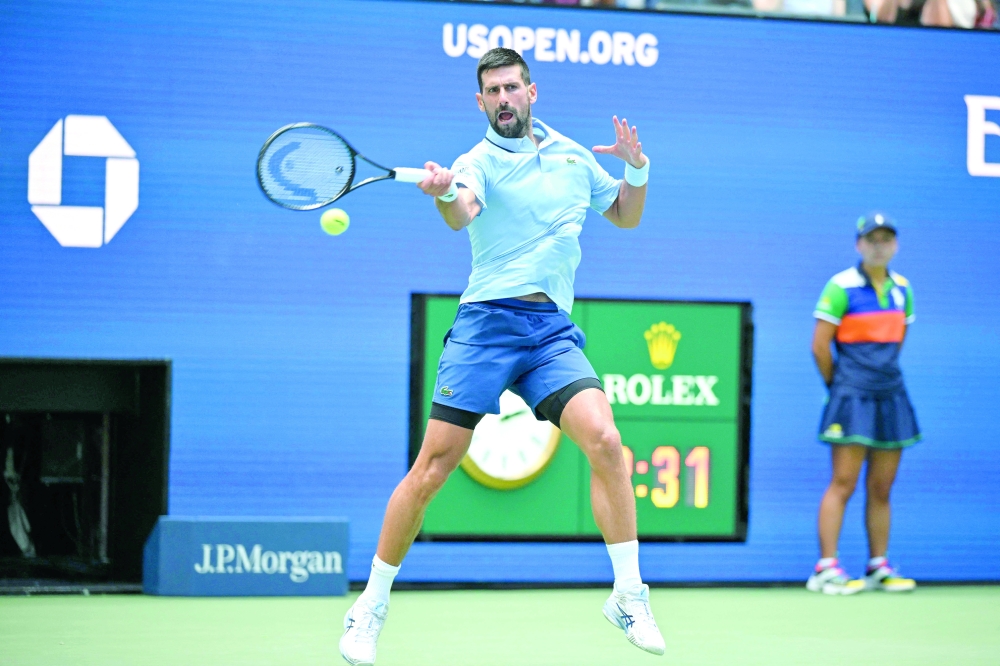Serbia's Novak Djokovic hits a return to USA's Zachary Svajda during their men's singles second round tennis match on day four of the US Open tennis tournament. — AFP
