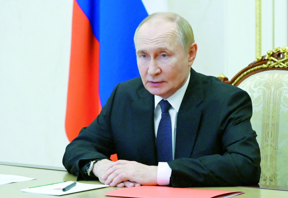 Russian President Vladimir Putin chairs a meeting with members of the Security Council via a video link in Moscow. — Reuters File