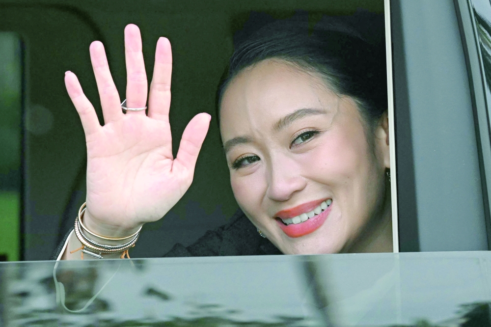 Thailand's sacked prime minister Paetongtarn Shinawatra leaves Government House after her dismissal by the Constitutional Court in Bangkok. — AFP
