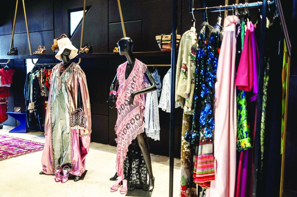 A general view inside Alara concept store in Lagos, on August 20, 2025. With its modern red and black architecture, Al疵a, West Africa's first luxury fashion and decor concept store, stands out in the Nigerian megacity of Lagos. Ten years in business, the store has established itself as a temple of Afro-luxury under the vision of its founder, businesswoman Reni Folawiyo. (Photo by OLYMPIA DE MAISMONT / AFP)
