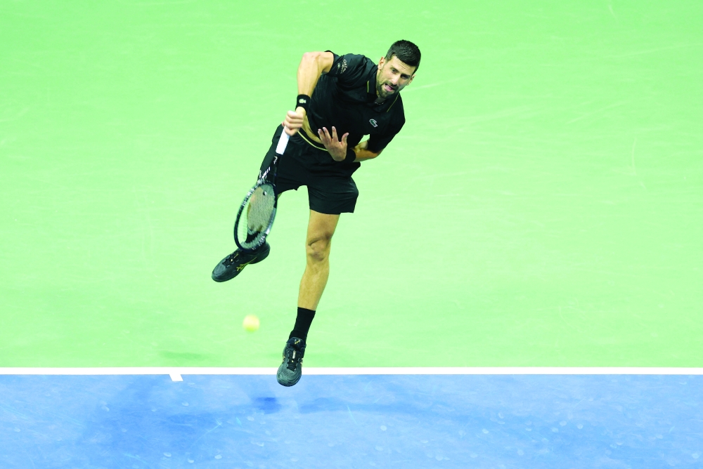 Serbia's Novak Djokovic serves to Britain's Cameron Norrie during their men's singles third round match on day six of the US Open tennis tournament. — AFP