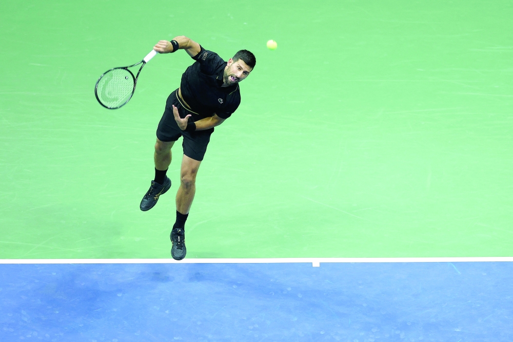 Serbia's Novak Djokovic serves to Germany's Jan-Lennard Struff during their men's singles round of 16 tennis match  on day eight of the US Open tennis tournament. — AFP 