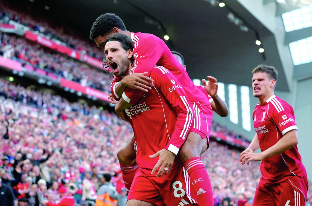 Liverpool's Dominik Szoboszlai celebrates scoring their first goal. — Reuters