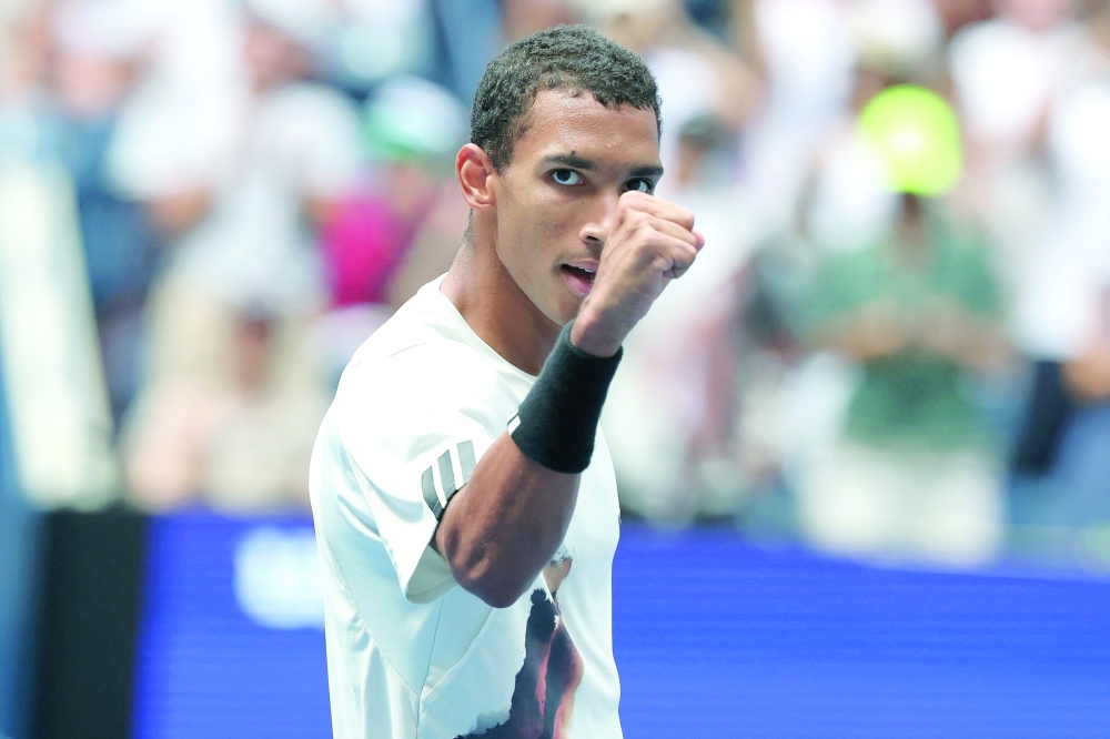 Canada's Felix Auger-Aliassime celebrates after winning the men's singles round of 16 tennis match against Russia's Andrey Rublev on day nine of the US Open tennis tournament at the USTA Billie Jean King National Tennis Center in New York City, on September 1, 2025.
