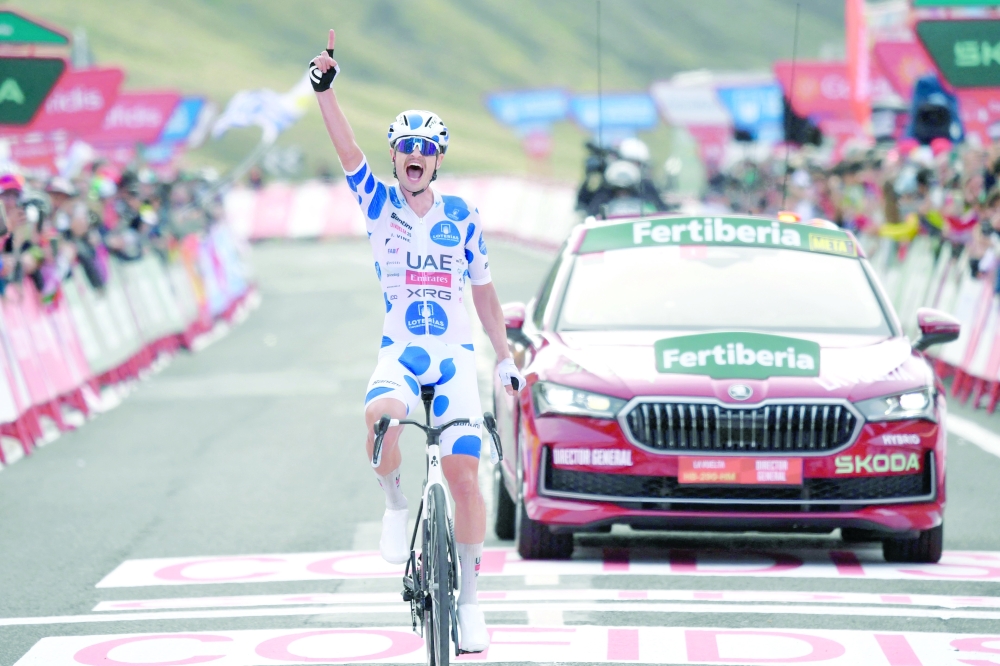 Team UAE's Australian rider Jay Vine celebrates winning the tenth stage of the Vuelta a Espana cycling tour, a 168 km race between Sendaviva Natural Park in Arguedas and El Ferial Larra Belagua in Isaba. — AFP