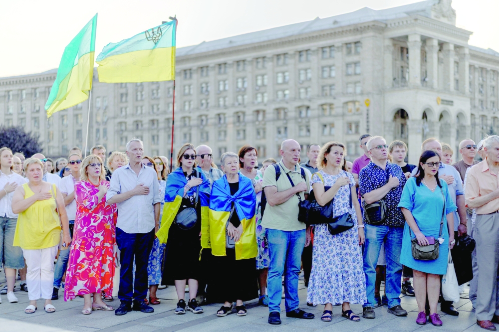 People attend a memorial service in Independence Square, in Kyiv. — Reuters