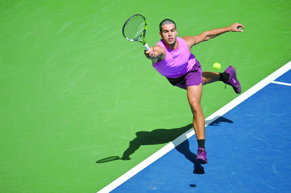 Spain's Carlos Alcaraz hits a return to France's Arthur Rinderknech during their men's singles round of 16 tennis match on day eight of the US Open tennis tournament. — AFP