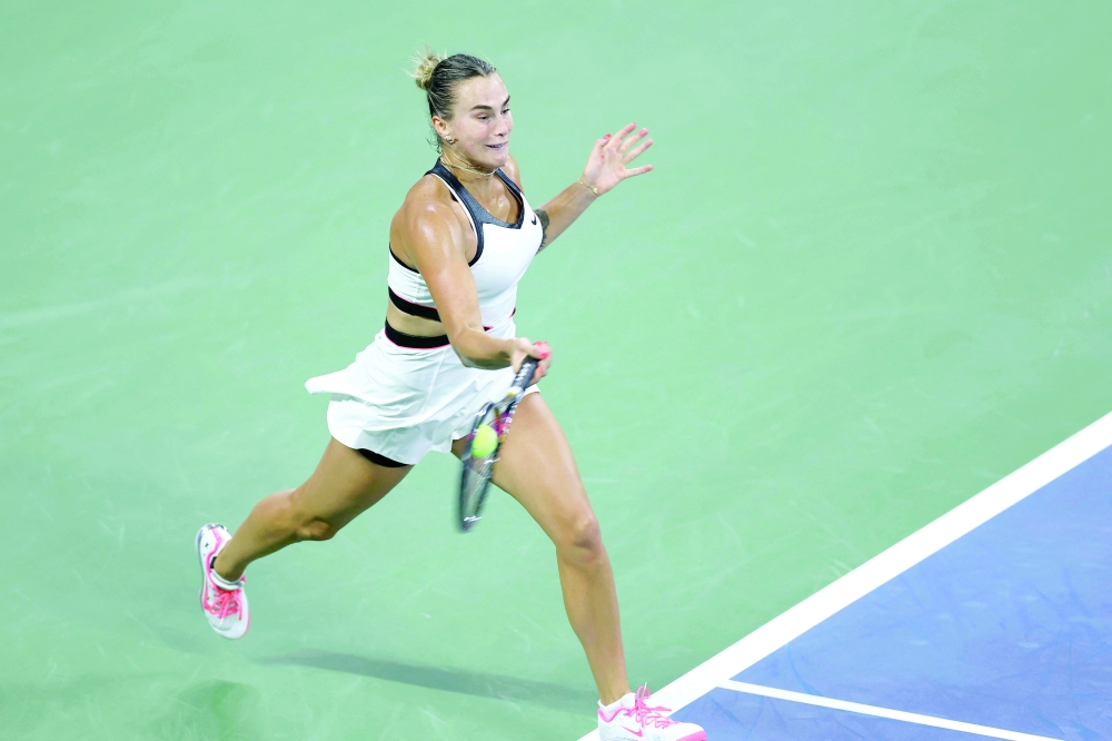 Belarus's Aryna Sabalenka plays a forehand return to Spain's Cristina Bucsa during their women's singles round of 16 tennis match on day eight of the US Open tennis tournament at the USTA Billie Jean King National Tennis Center in New York City, on August 31, 2025. 