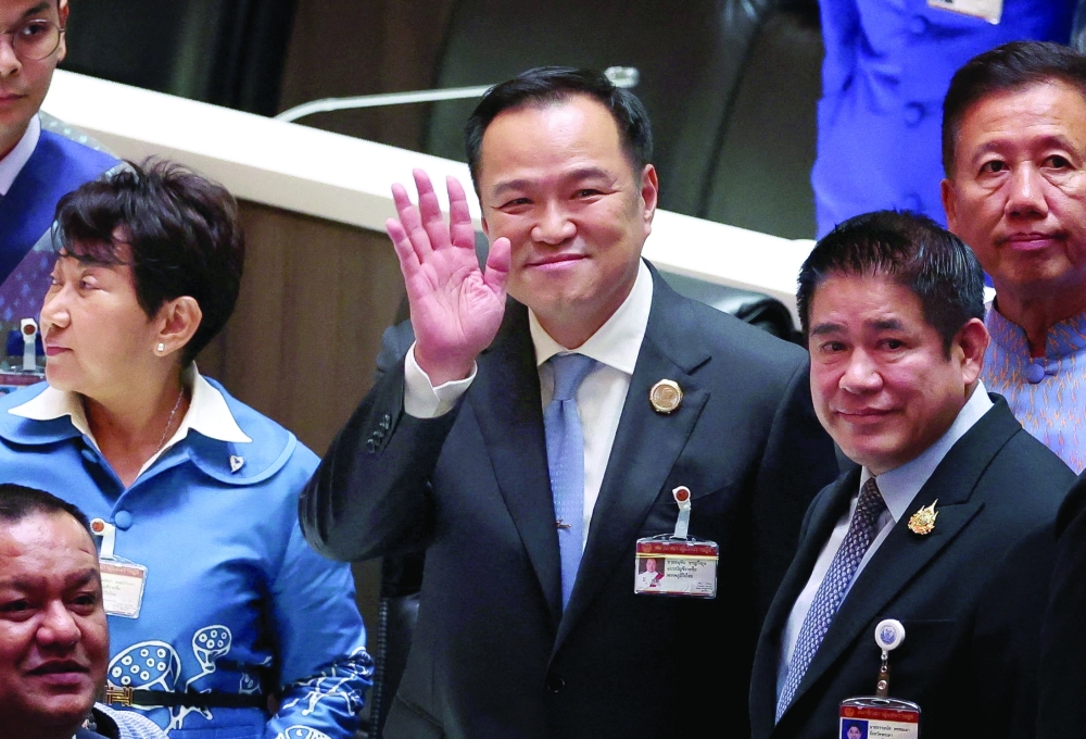 Bhumjaithai Party leader Anutin Charnvirakul gestures after he was elected Thailand's new prime minister. — Reuters
