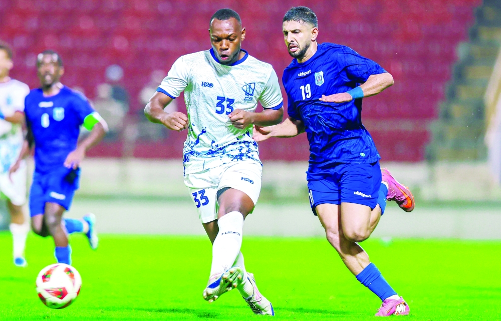 Al Nasr and Sur players race for the ball