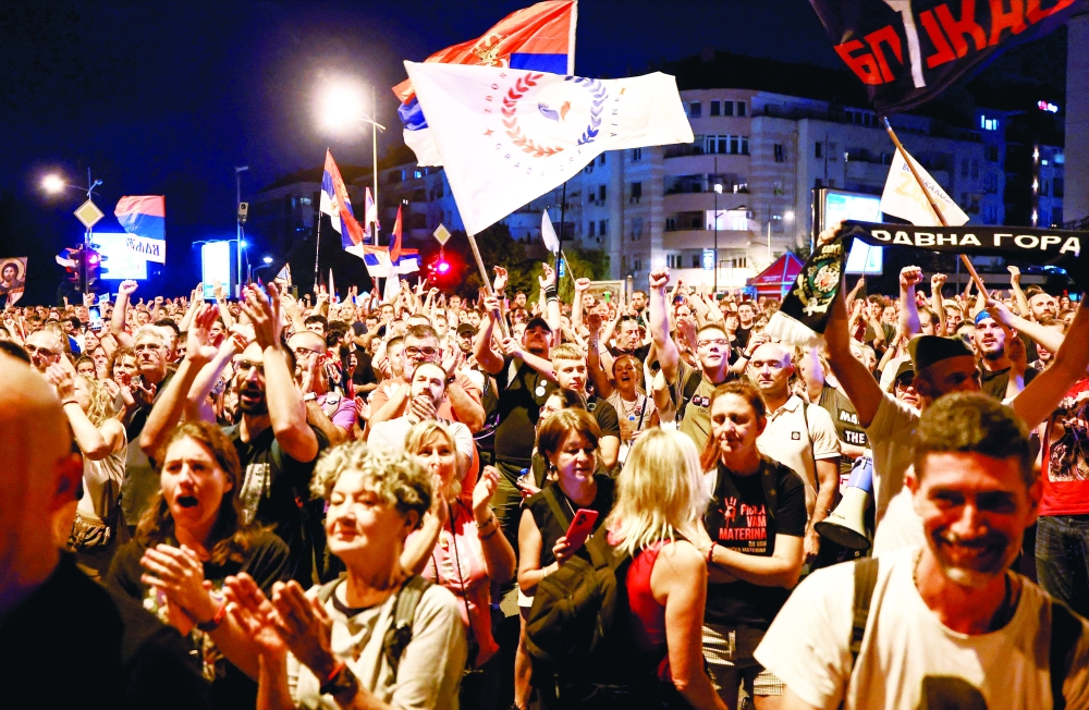 People gather during a protest against, in Novi Sad, Serbia. — Reuters