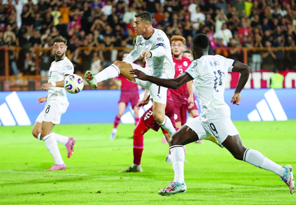 Portugal's Cristiano Ronaldo scores their second goal. —Reuters