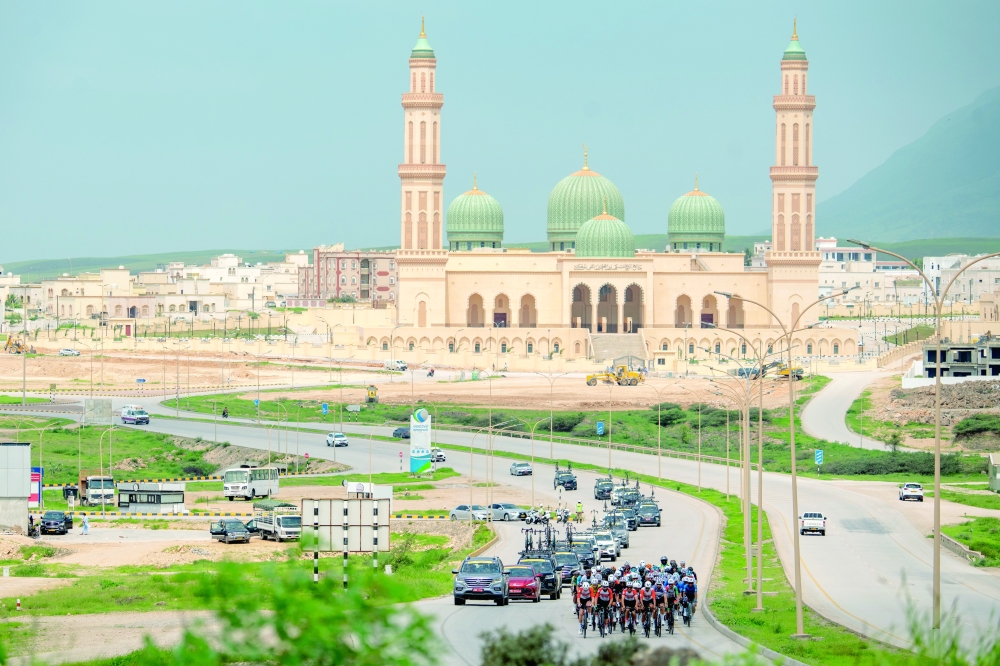 The pack rides during the third stage of Tour of Salalah 2025
