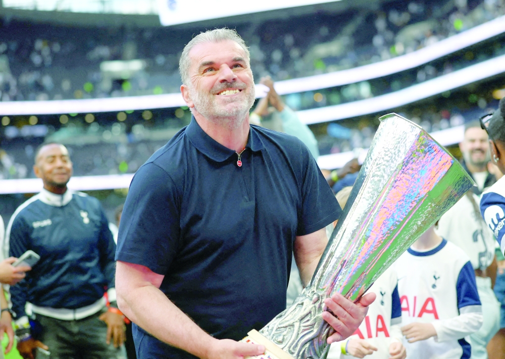 FILE PHOTO: Tottenham Hotspur manager Ange Postecoglou with the Europa League trophy. — Reuters