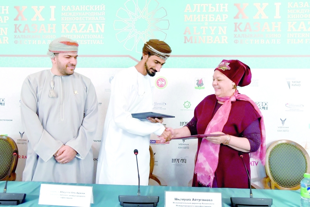 Milyausha Aituganova and Mohammed al Ajmi, after signing the agreement in Kazan