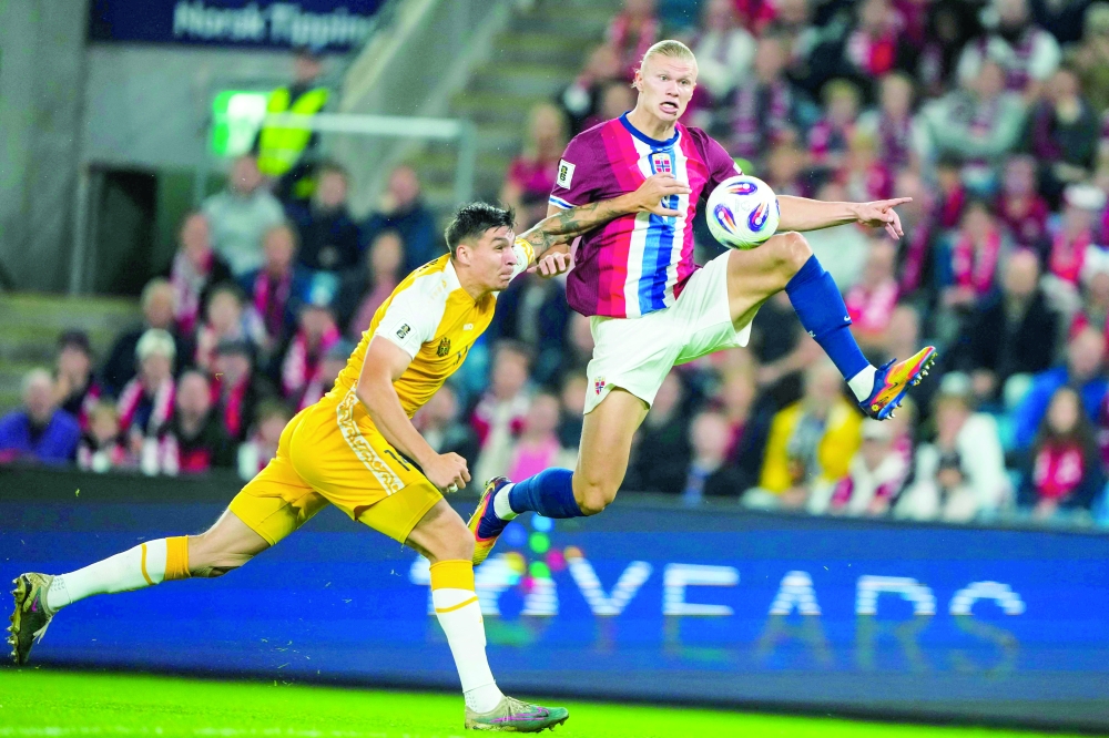 Erling Braut Haland (R) vies with Moldova's defender Artur Craciun during the 2026 World Cup qualifiers Europe zone group I football match between Norway and Moldova. — AFP 