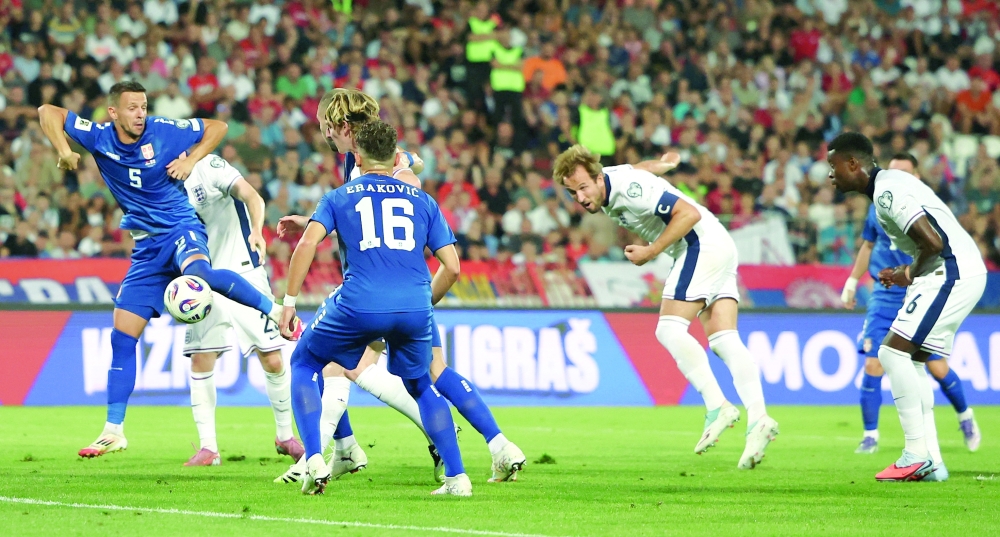 England's Harry Kane scores their first goal. — Reuters