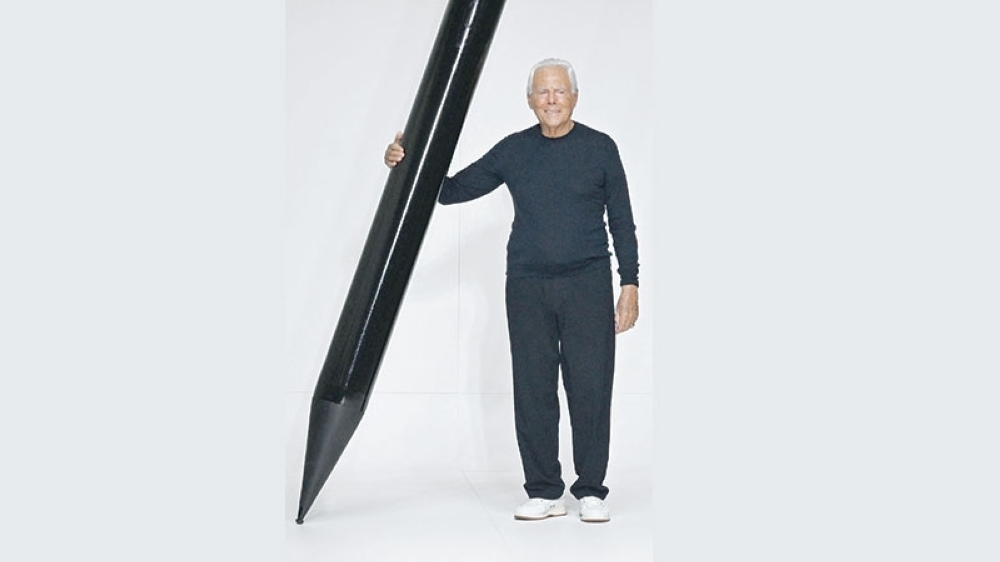 Italian fashion designer Giorgio Armani acknowledges the audience at the end of the Armani Men's Spring - Summer 2024 fashion show as part of the Fashion Week in Milan, on June 19, 2023. Italian fashion great Giorgio Armani has died at the age of 91 "surrounded by his loved ones", his company said on September 4, 2025. (Photo by Andreas SOLARO / AFP)
