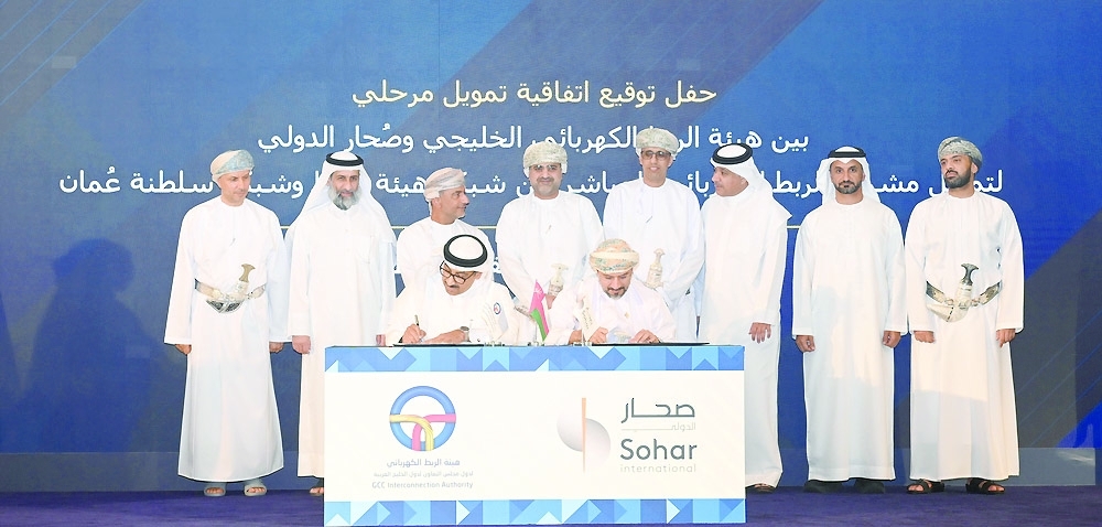 Officials at the signing of the $500 million interim financing agreement