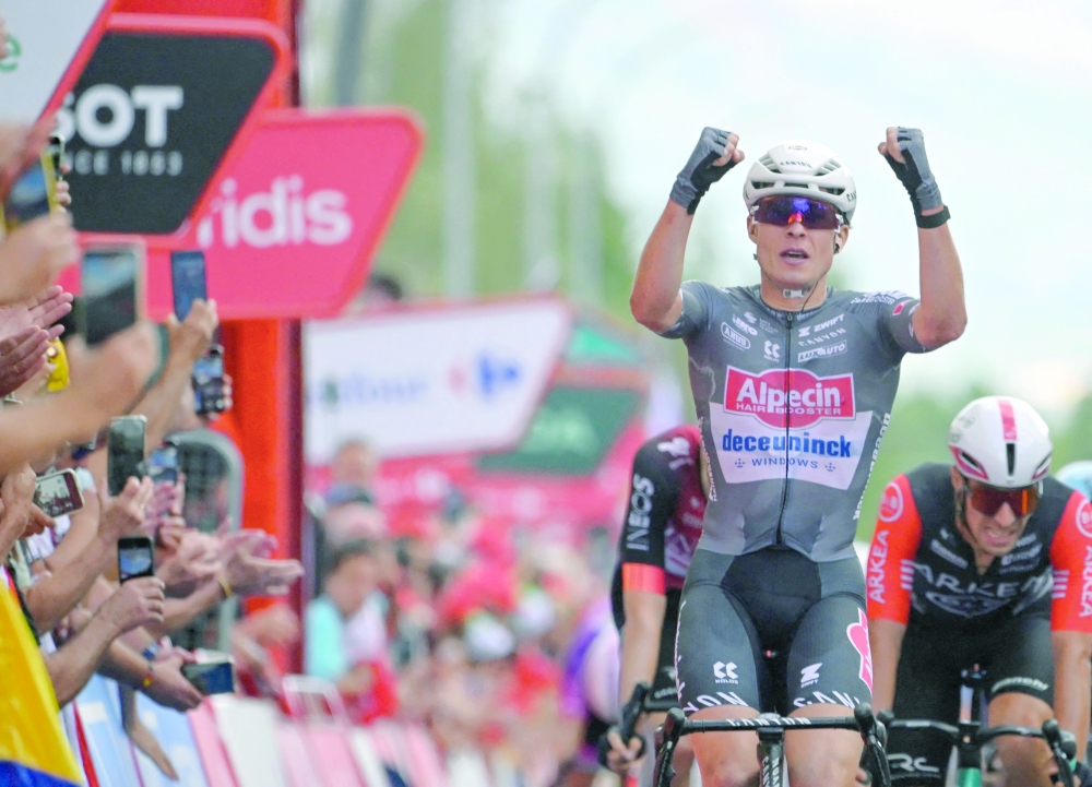 Stage winner team Alpecin's Belgian rider Jasper Philipsen celebrates crossing first the finish line of the 19th stage of the Vuelta a Espana, a 159 km race between Rueda and Guijuelo, on September 12, 2025.   (Photo by Miguel RIOPA / AFP)
