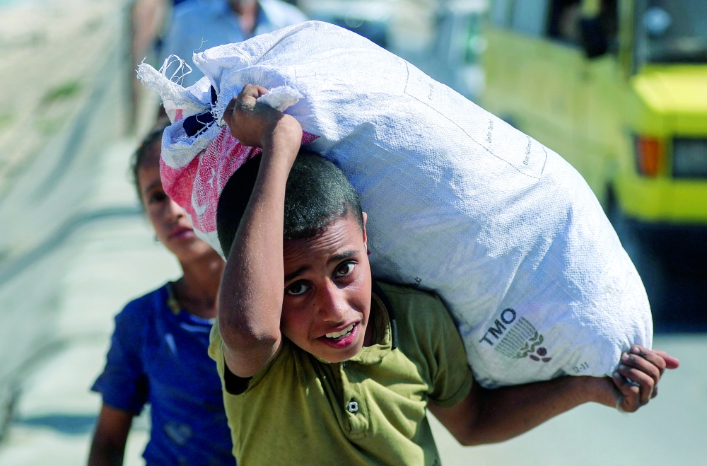 ‏Displaced Palestinians, fleeing northern Gaza due to an Israeli military operation, on Saturday. — Reuters