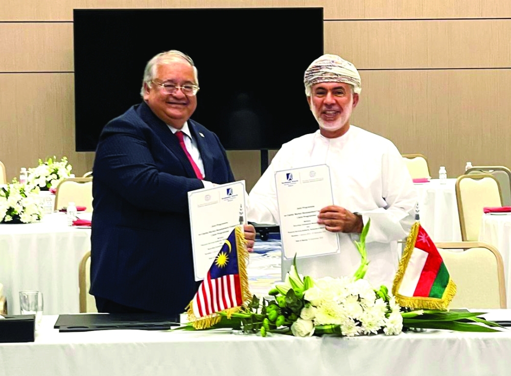 Abdullah bin Salim al Salmi, Executive President — Financial Services Authority and Dato’ Mohammad Faiz Azmi, Chairman of the FC Malaysia, signing the agreement last week.