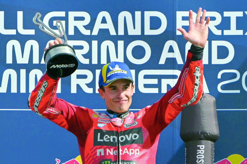 Ducati Lenovo Team's Spanish MotoGP rider Marc Marquez celebrates his victory on the podium at the end of the San Marino Moto GP Grand Prix. — AFP
