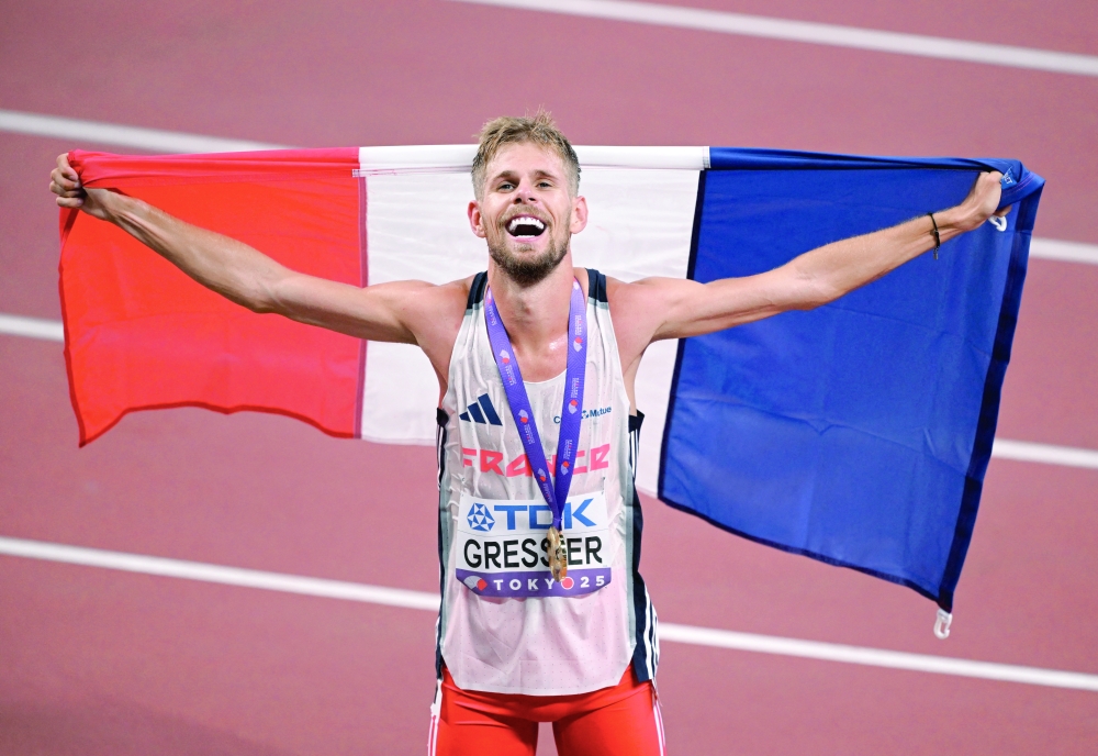 France's Jimmy Gressier celebrates with a France flag after winning the final. — Reuters