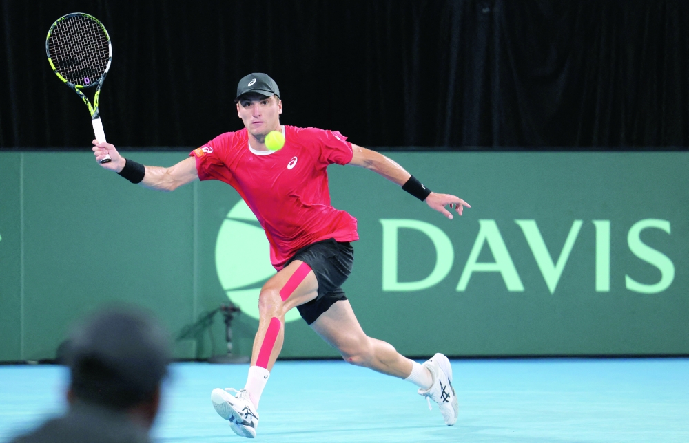 Belgium's Raphael Collignon in action during his singles match against Australia's Aleksandar Vukic. — Reuters