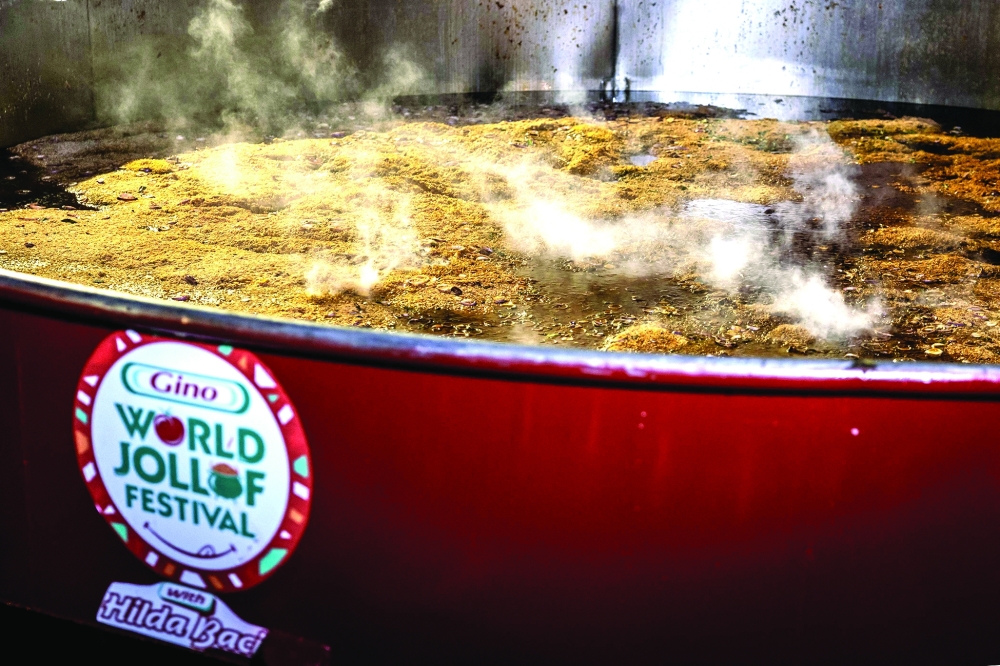 Rice simmers  is seen in a giant pot during an attempt to break the world record for the largest pot of Jollof rice, led by Nigerian chef Hilda Baci in Lagos, on September 12, 2025. 