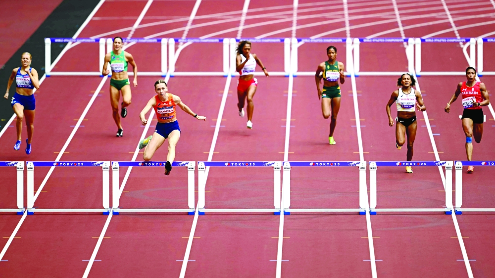 Netherlands' Femke Bol (C-L) competes ahead of Belgium's Naomi van den Broeck (R) and Finland's athlete Hilla Uusimaki (L) in the women's 400m hurdles heats during the World Athletics Championships in Tokyo on September 15, 2025. (Photo by Yuichi YAMAZAKI / AFP)

