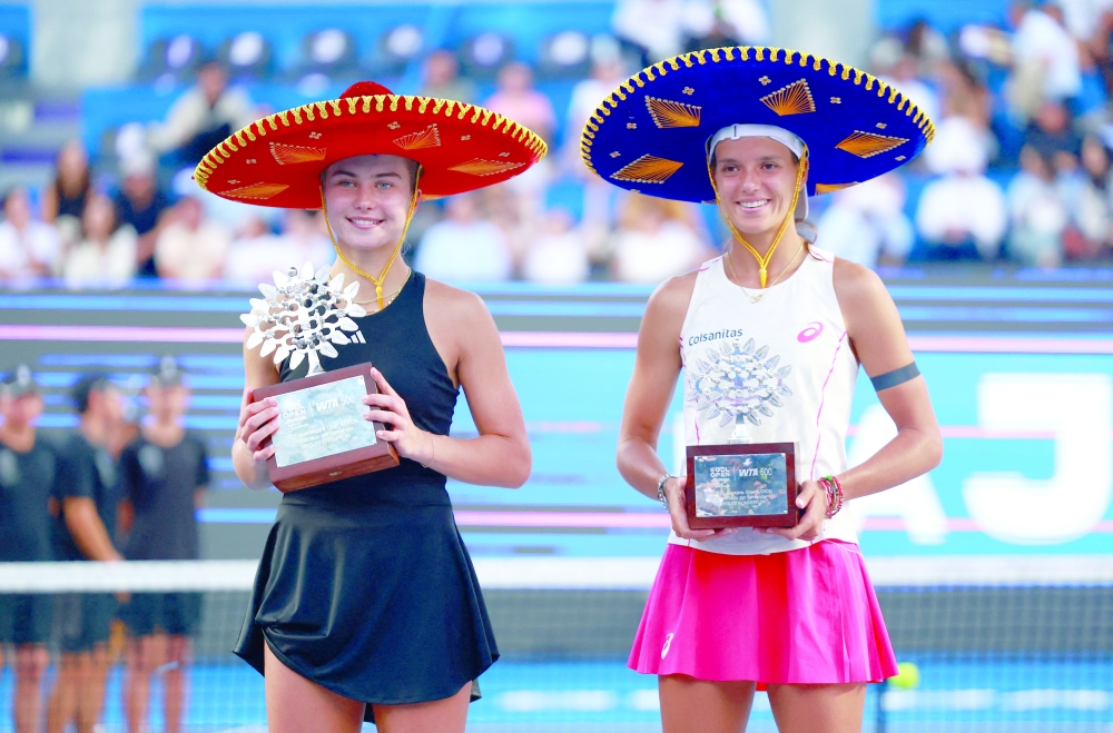 Iva Jovic of the US celebrates with the trophy after winning the Guadalajara Open alongside runner-up Colombia's Emiliana Arango. — Reuters