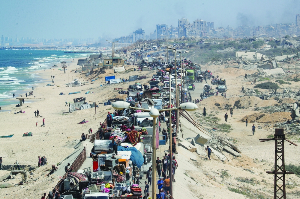 
Displaced Palestinians, fleeing northern Gaza, move southward. — Reuters 