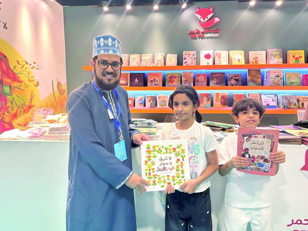 Author Ahmed bin Nasser al Rashdi with children
