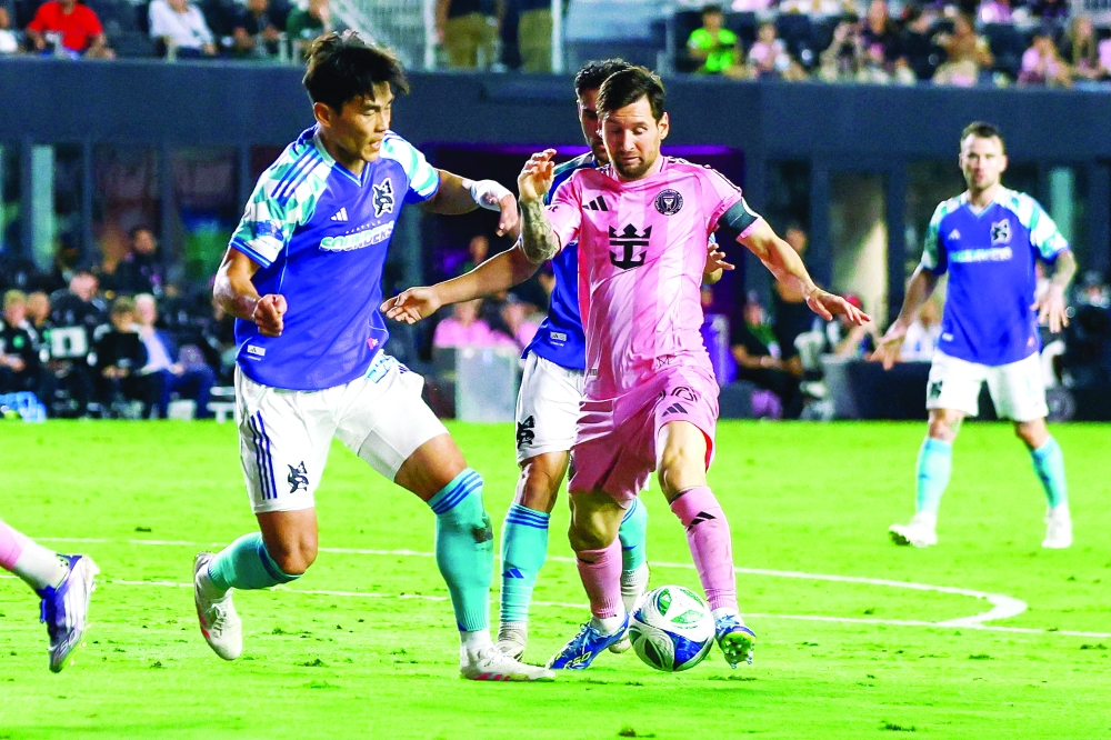 Inter Miami's Argentine forward #10 Lionel Messi (C) fights for the ball with Seattle Sounders FC South Korean defender #20 Kim Kee-Hee (L) during the Major League Soccer (MLS). — AFP 