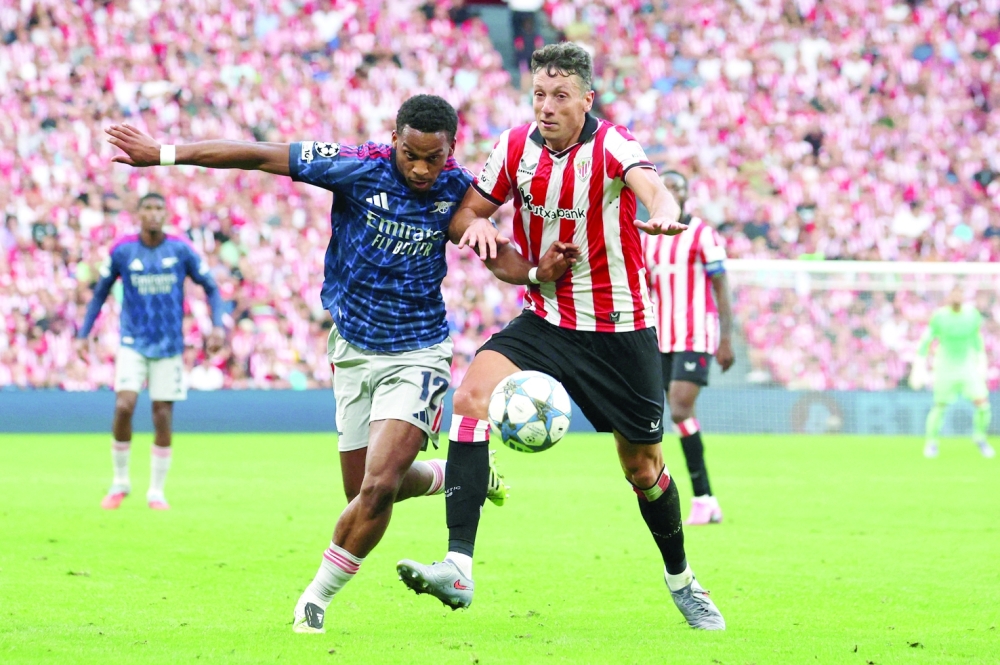 Arsenal's Jurrien Timber in action with Athletic Bilbao's Mikel Vesga. — Reuters