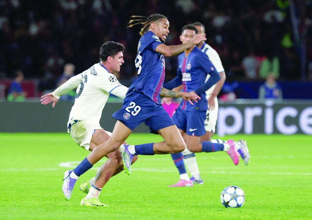 Atalanta's Raoul Bellanova in action with Paris St Germain's Bradley Barcola. — Reuters