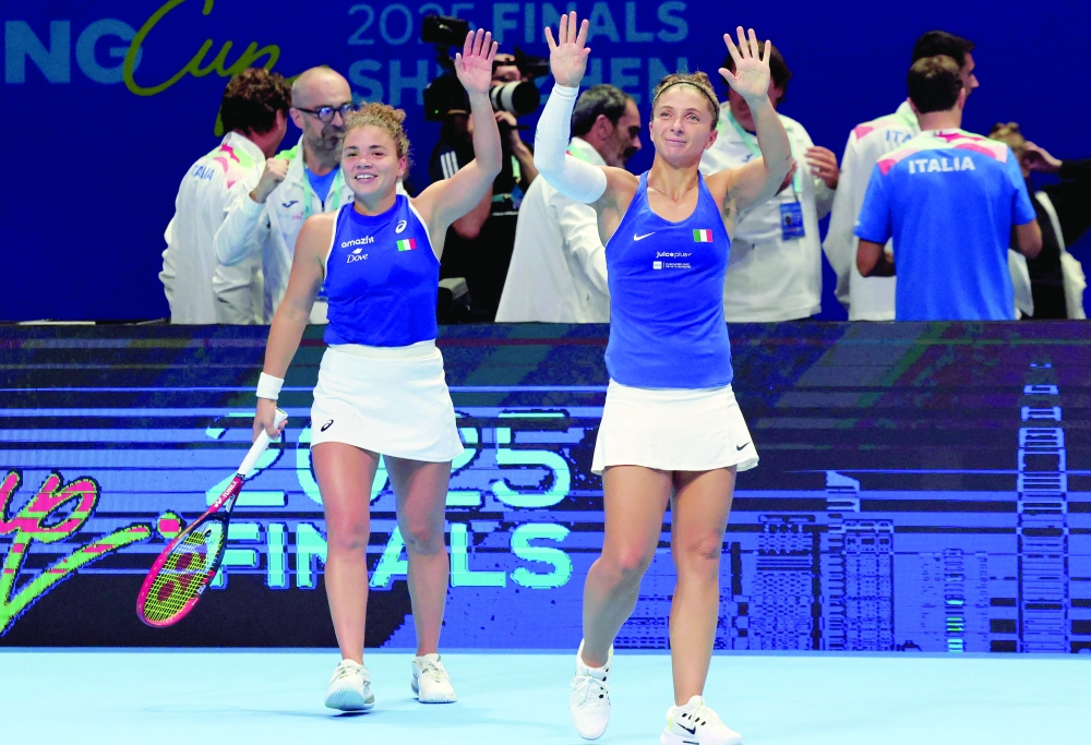 Italy's Sara Errani (R) and Italy's Jasmine Paolini celebrate after winning against Ukraine's Lyudmyla Kichenok and Marta Kostyuk during their doubles semi-final match at the Billie Jean King Cup in Shenzhen, southern China's Guangdong province on September 19, 2025.  - China OUT
 (Photo by AFP)
