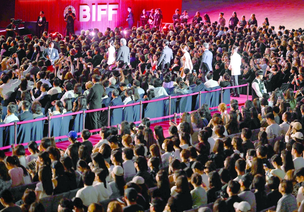 South Korean director Park Chan-wook and actors Lee Byung-hun, Son Ye-jin, Park Hee-soon, Lee Sung-min and Yeom Hye-ran walk on the red carpet during the opening ceremony of the 30th Busan International Film Festival (BIFF) at the Busan Cinema Center in Busan on September 17, 2025.