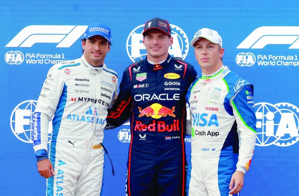 Red Bull's Max Verstappen, Williams' Carlos Sainz Jr and RB's Liam Lawson pose for a photo after qualifying. — Reuters