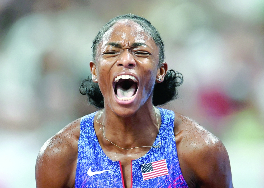 Melissa Jefferson-Wooden of the U.S. celebrates after winning gold. — Reuters