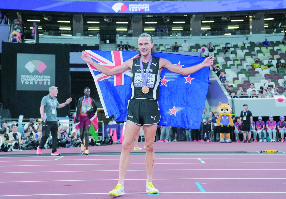 New Zealand's Geordie Beamish celebrates with his medal and national flag after winning gold in the final. — Reuters