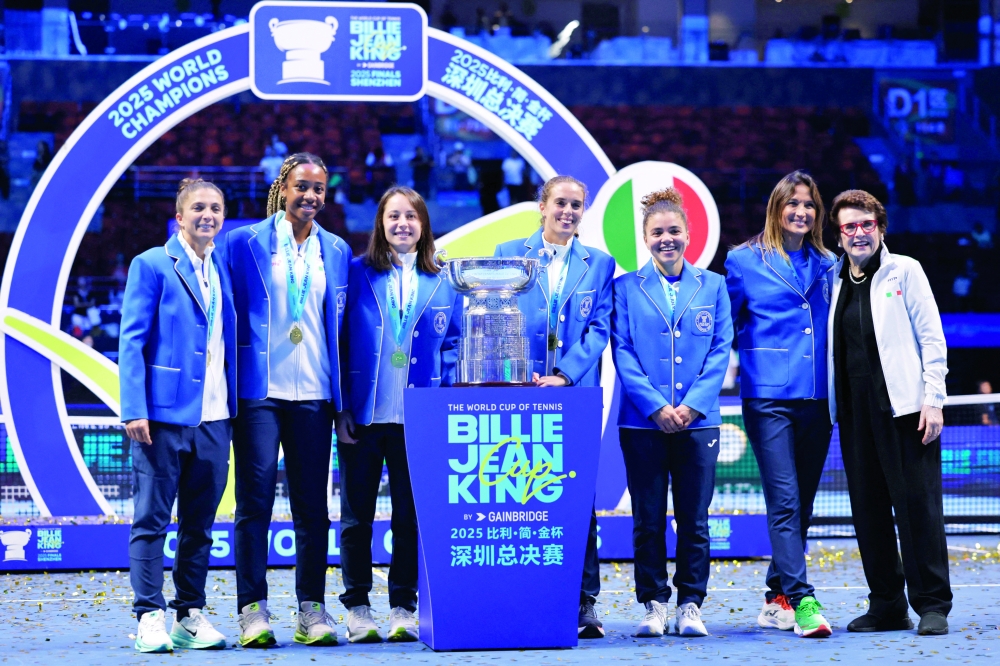 Italy's Jasmine Paolini, Lucia Bronzetti, Elisabetta Cocciaretto, Tyra Grant, Sara Errani and captain Tathiana Garbin celebrate with the trophy after winning the final. — Reuters