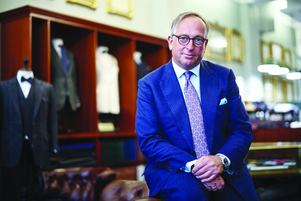 Simon Cundy, Managing Director Henry Poole & Co, poses inside the front of house of Henry Poole & Co on Savile Row in London on August 12, 2025. Beneath the old-world exterior of a tailors on London's famed Savile Row, the workshop where the magic happens is more youthful than ever as aspiring coatmakers vie for competitive apprenticeships.
 (Photo by HENRY NICHOLLS / AFP)
