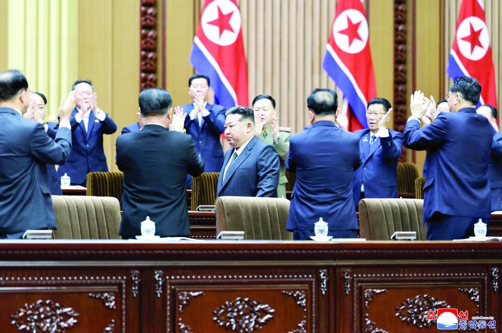 Officials applaud North Korean leader Kim Jong Un during a meeting at the Mansudae Assembly Hall in Pyongyang. — Reuters