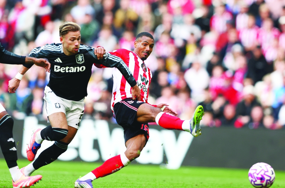Soccer Football - Premier League - Sunderland v Aston Villa - Stadium of Light, Sunderland, Britain - September 21, 2025 Aston Villa's Matty Cash in action as Sunderland's Wilson Isidor scores their first goal REUTERS